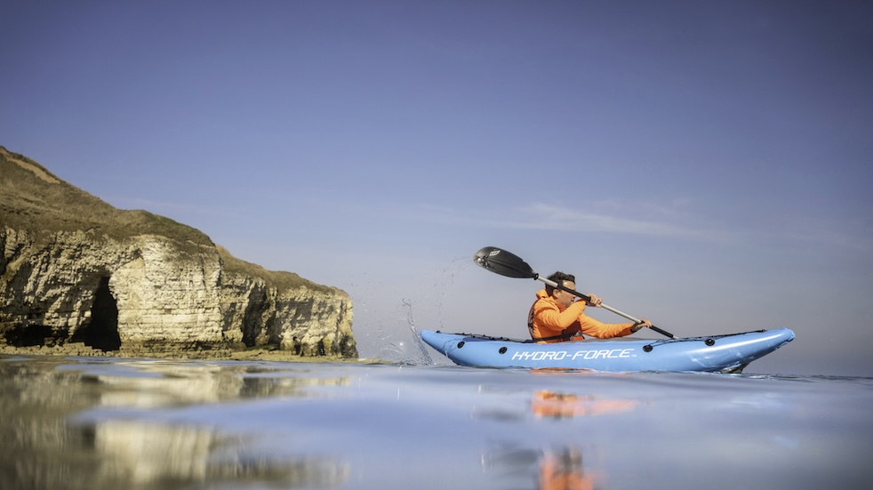 Side view of Sam Philip kayaking in the North Landing, Yorkshire